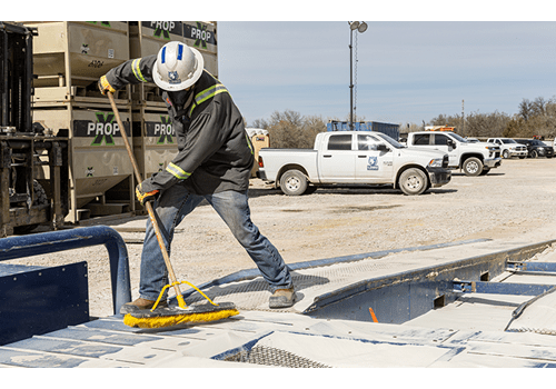 Lobo Logistics co-worker cleaning up.