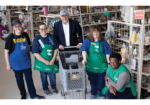 arc Thrift Store CEO and employees smiling about being customers and partners with BOK Financial.