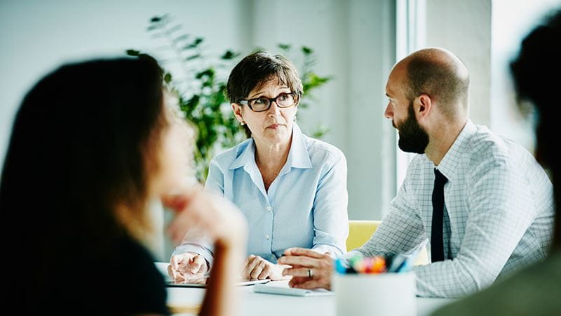 Business partners discussing debt